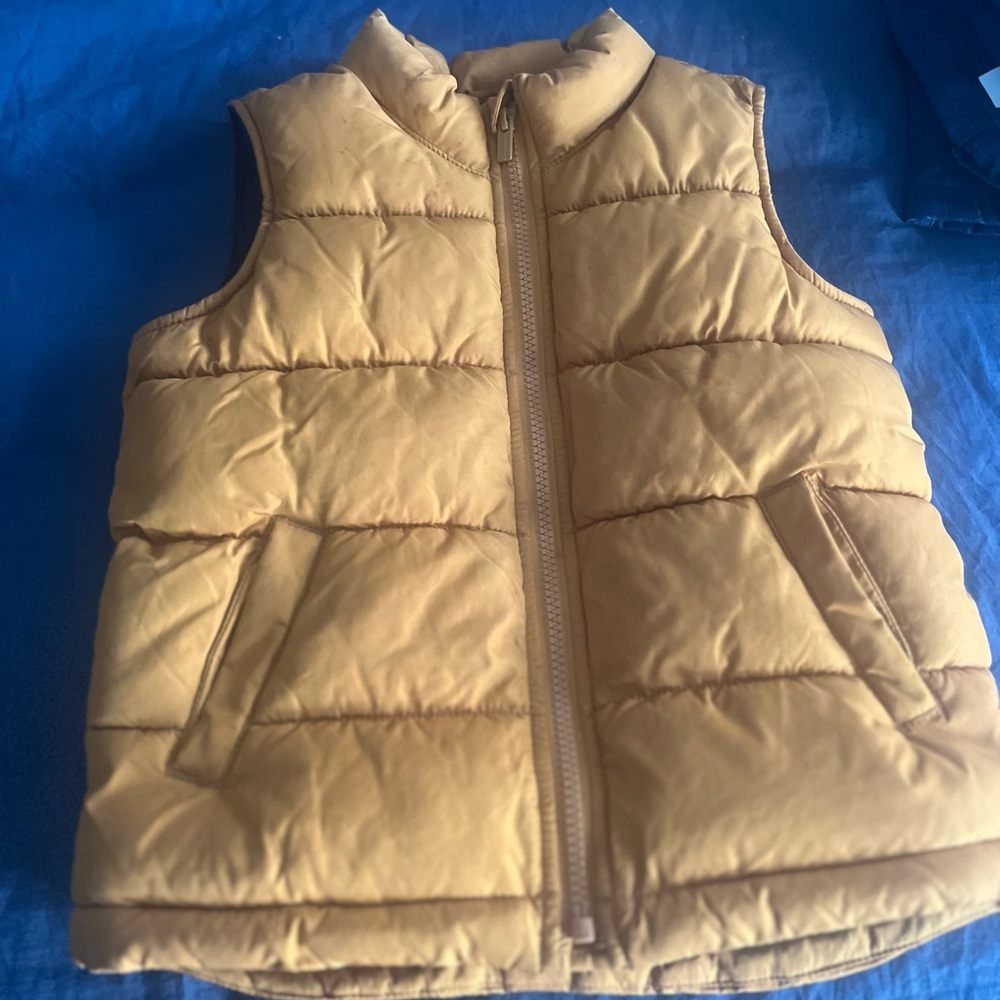 Boys fleece lined puffer vest. This is like a mustardy caramel color.